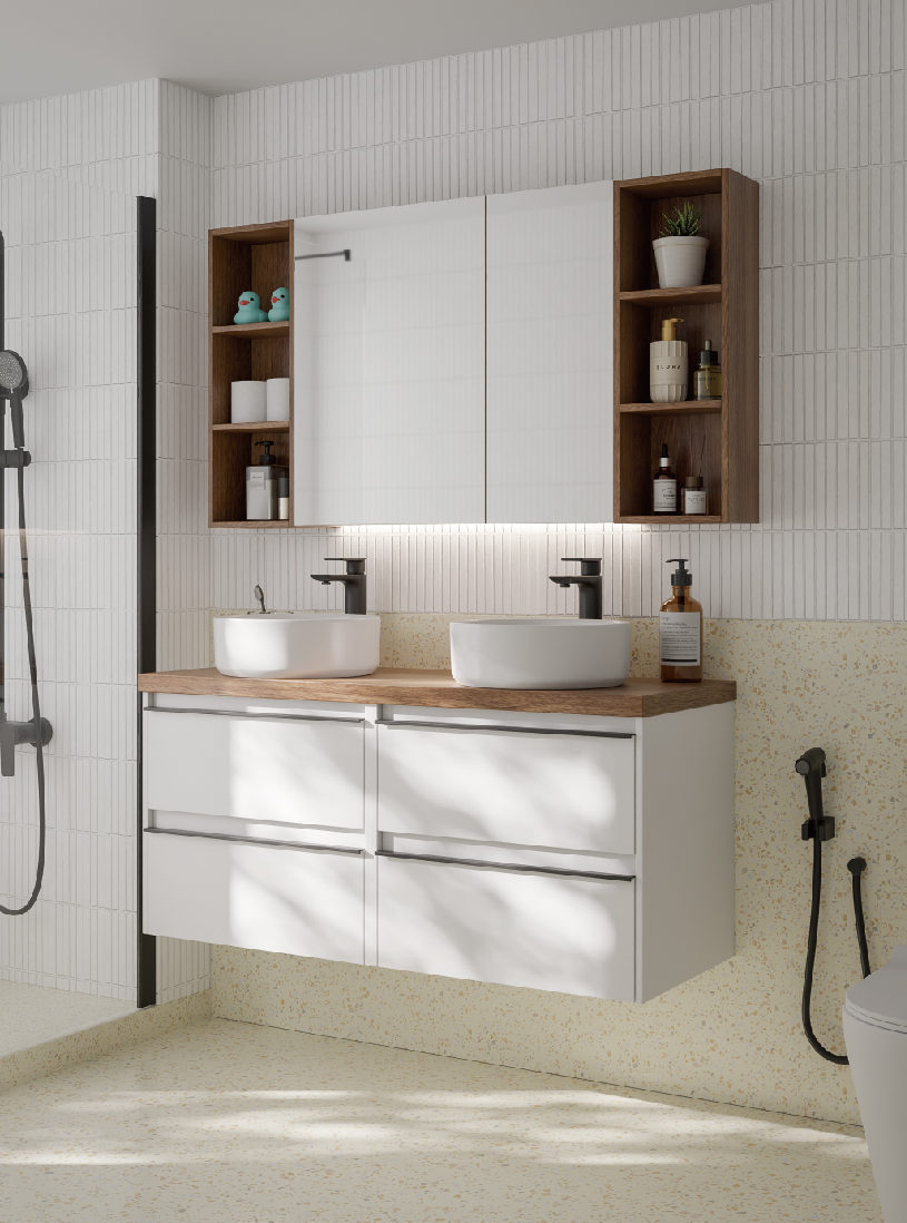 An ATHENA white double vanity under a lit mirror cabinet