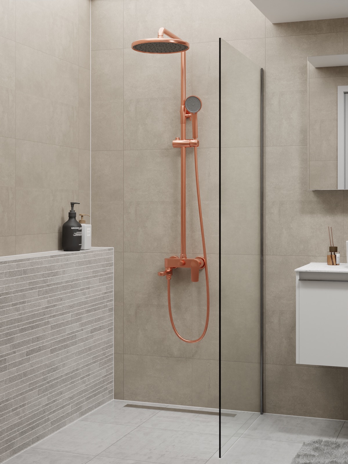 A Rose Gold rain shower behind a clear glass panel
